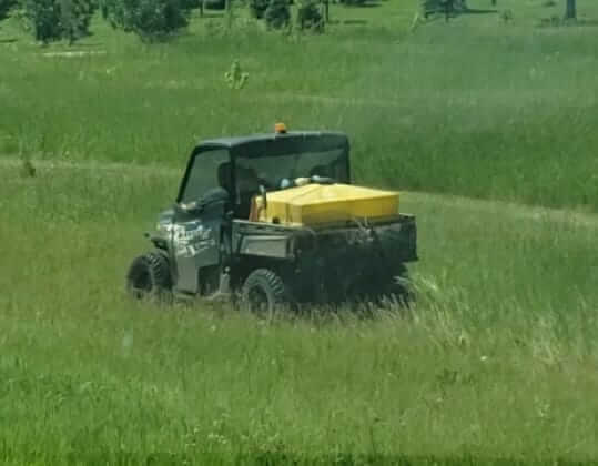 Weed sprayer in field